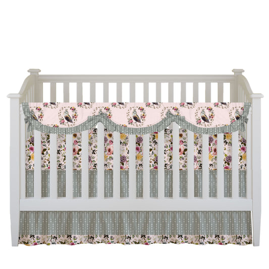 Girls Owl Crib Set includes a Ruffled Rail Cover with scallops featuring owls in a floral wreath on a soft blush background with sage arrow ruffles and ties, a floral crib sheet in soft blush, and a sage arrow ruffled crib skirt with floral trim.