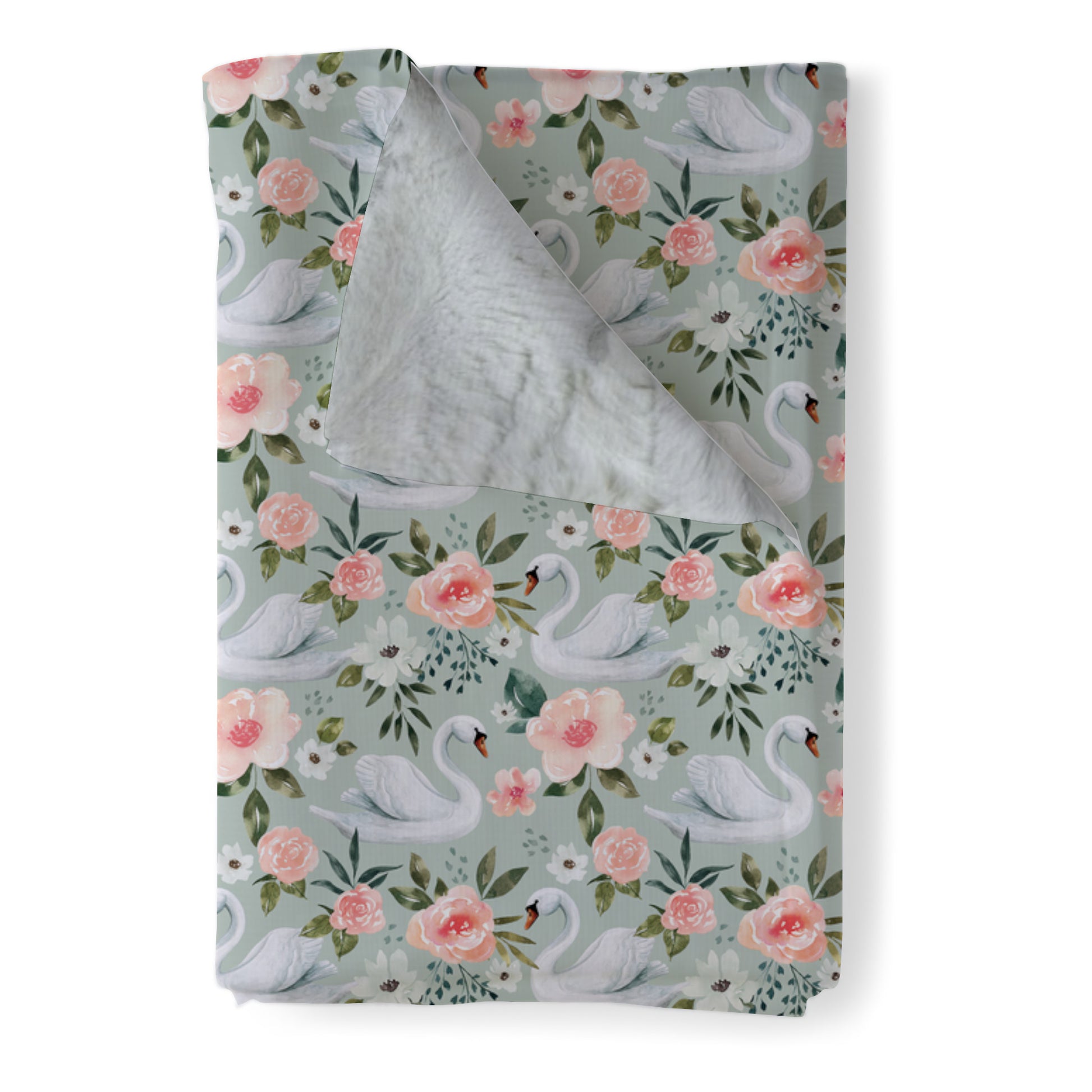 Swan Baby Blanket in Mint with Natural minky backing, available in lovey, baby, and toddler sizes. White swans surrounded by pale pink, and dusty pink flowers on a mint background.